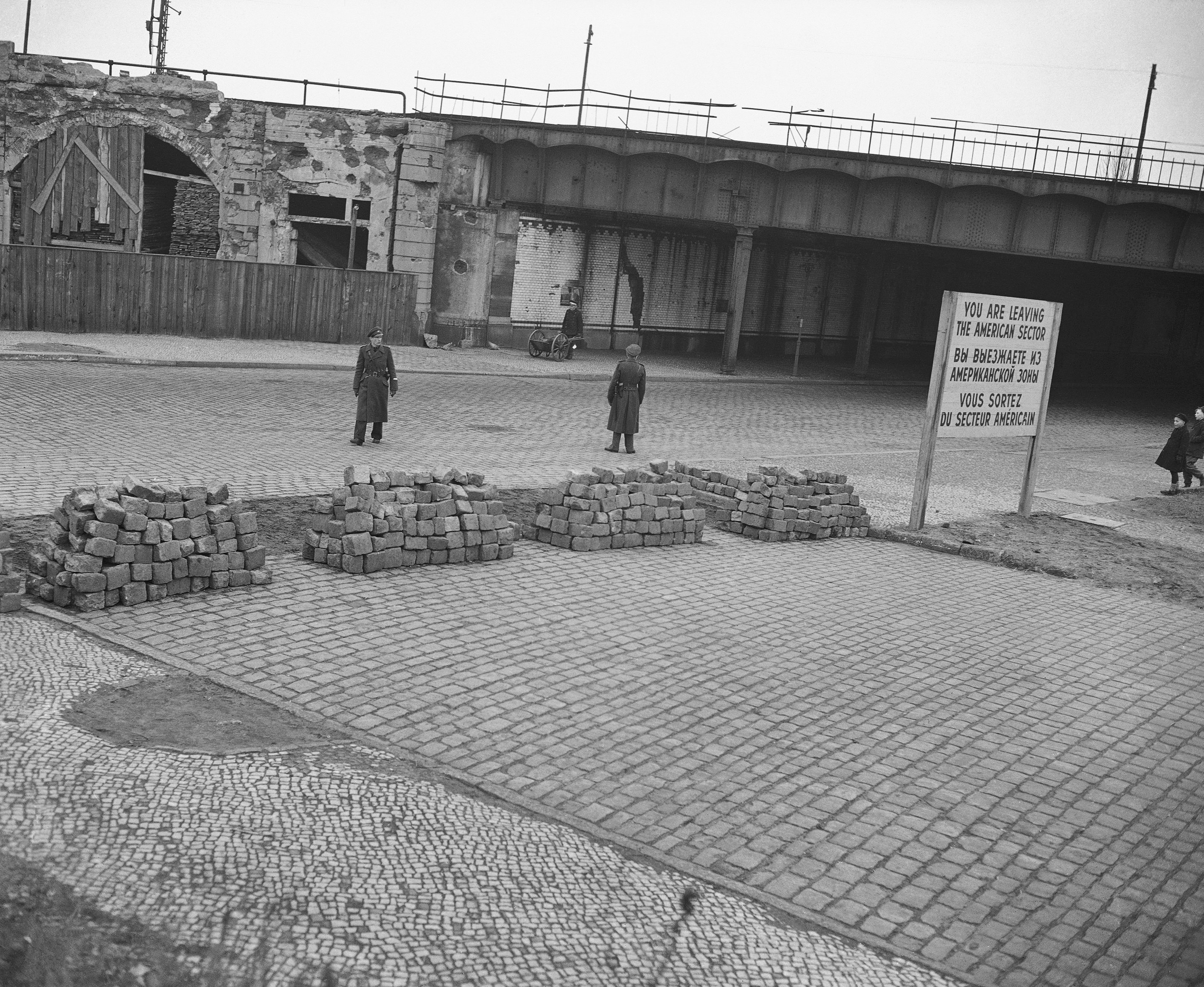 Bricks torn up from the street made this new barricade between the Neukolln District, in the American sector of Berlin, and the Treptow District, in the Soviet zone, Feb. 22, 1949